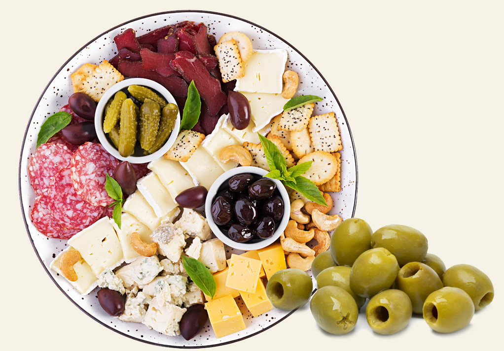 Delicious charcuterie board featuring cured meats, cheeses, olives, and crackers for gourmet snacking.