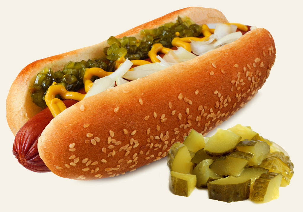 Classic hot dog in sesame seed bun with mustard, relish, onions, and dill pickles.