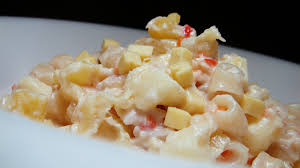 Creamy elbow macaroni with melted cheese and seafood for a comforting, delicious meal.