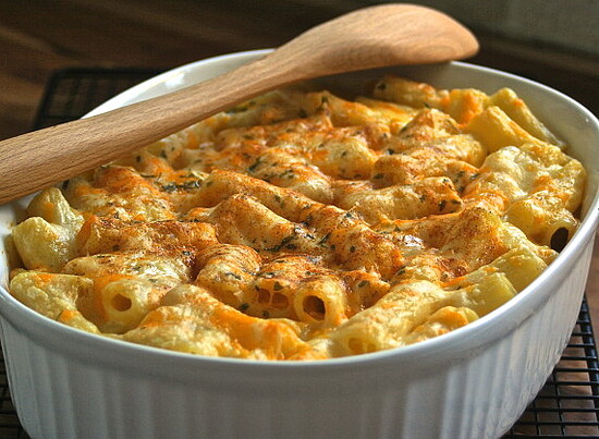 Delicious golden mac and cheese casserole with crispy crust and creamy rigatoni pasta.