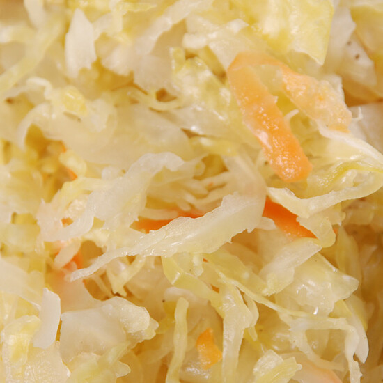 Fresh shredded cabbage and carrots, vibrant colors ideal for salads or healthy side dishes.