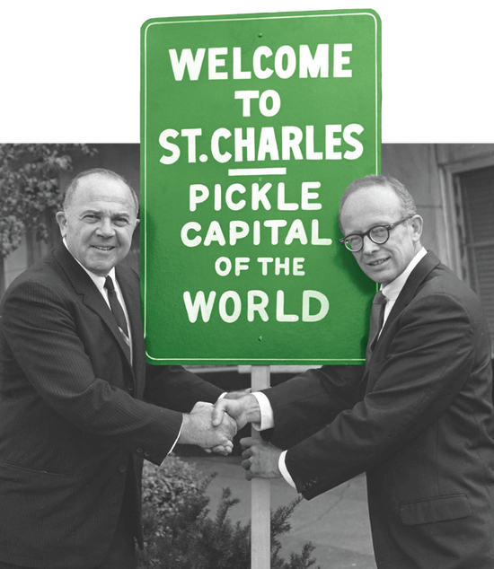 Celebrating St. Charles, the Pickle Capital of the World, with a handshake and a vibrant sign.