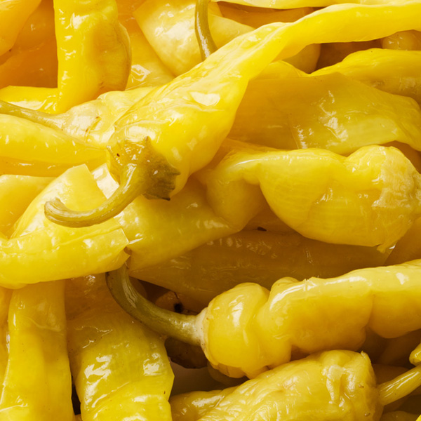 Vibrant yellow peppers arranged beautifully, showcasing freshness and culinary potential.